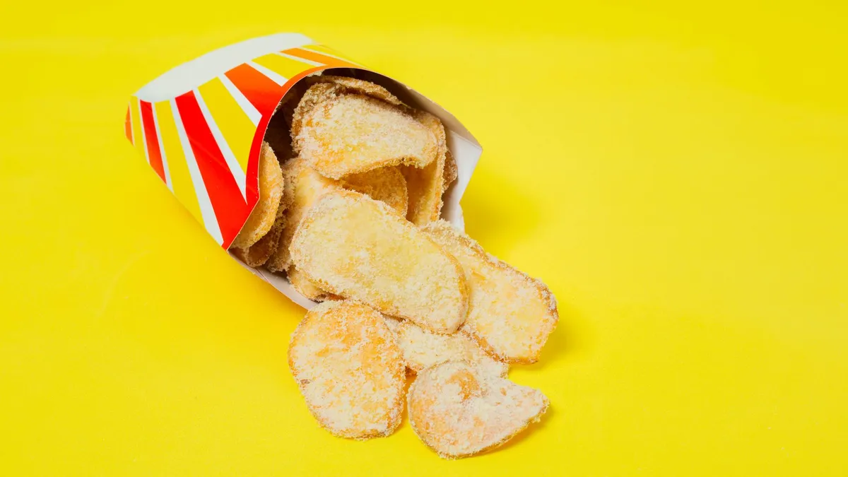 A salty takeaway meal on a table, a common cause of water retention