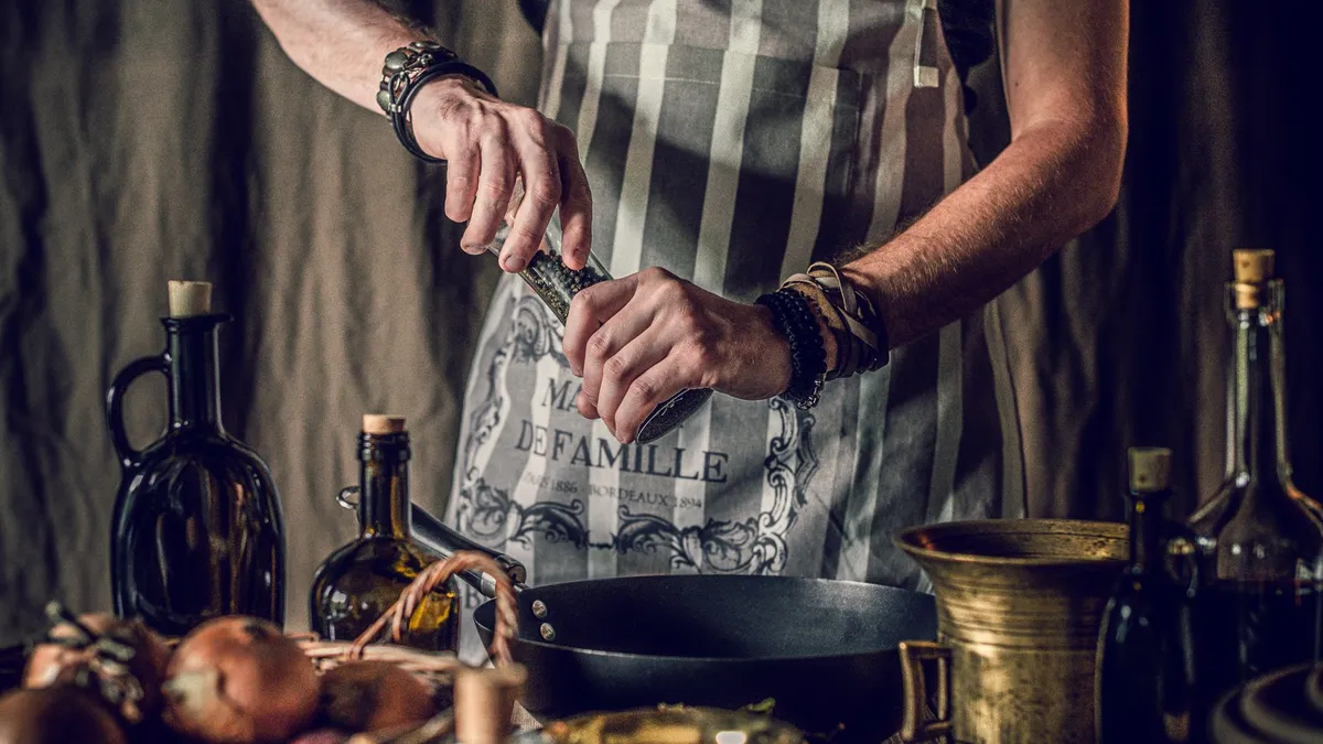 Someone plating a high-protein dinner at home in a bright kitchen