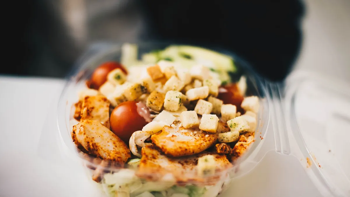 Colourful balanced meals in glass containers on a kitchen counter